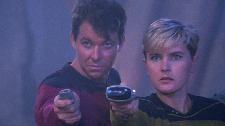 Riker and Yar concerned in Star Trek: The Next Generation