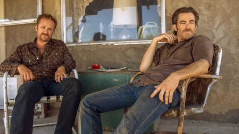 Two brothers sit on porch