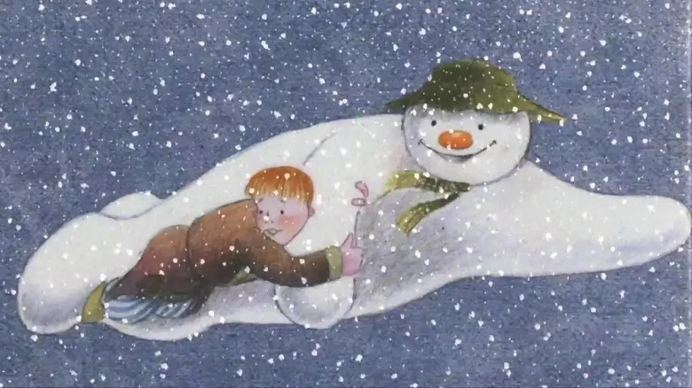 The Snowman's Snowman flying with little boy in arms