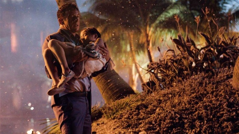 Jack Harris holding child in Skyfire