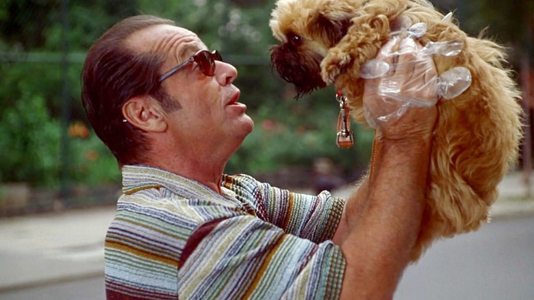 Jack Nicholson holds an adorable dog as Melvin Udall in As Good as It Gets