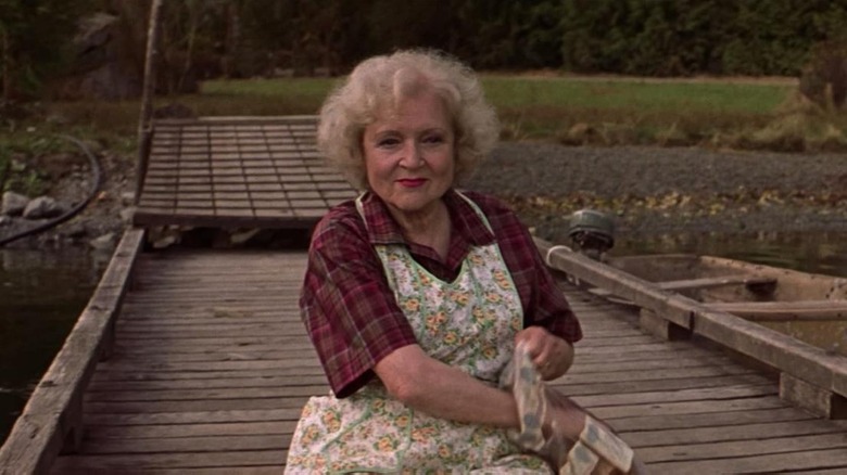 Betty White as Mrs. Dolores Bickerman in an apron in Lake Placid