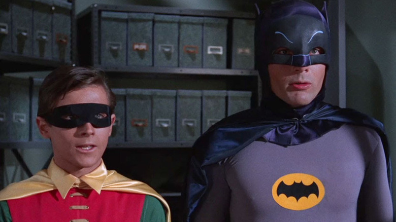 Bert Ward in the role of Robin and Adam West in the role of Batman, looking at something outside the camera