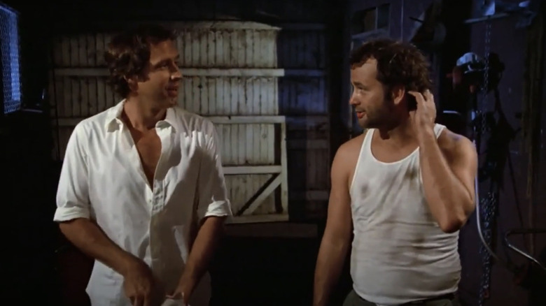 Chevy Chase as Ty Cobb and Bill Murray as Carl Spacker talking in Caddyshack