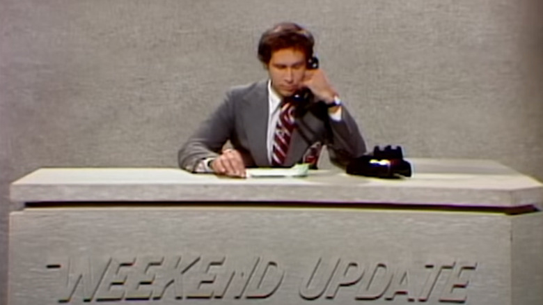 Chevy Chase on the phone during Weekend Update on SNL