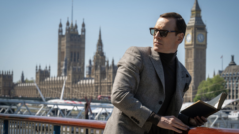 Michael Fassbender as espionage agent George Woodhouse standing in front of Big Ben in London in Black Bag