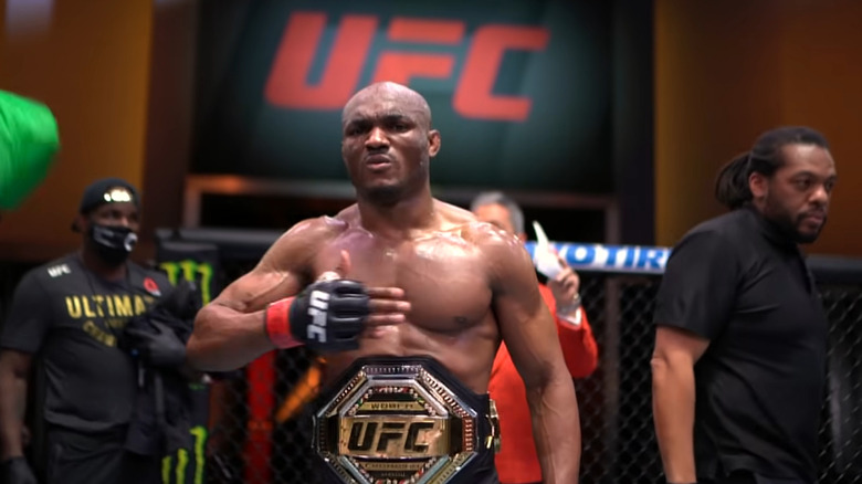 Kamaru Usman shows off his UFC Welterweight Championship belt