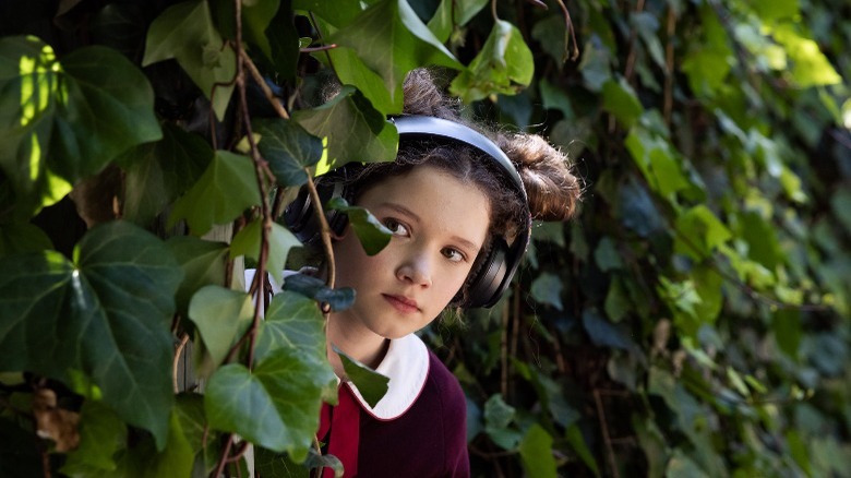 julia savage looking behind bushes