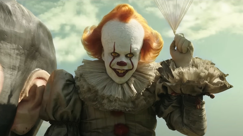 Pennywise holding balloons