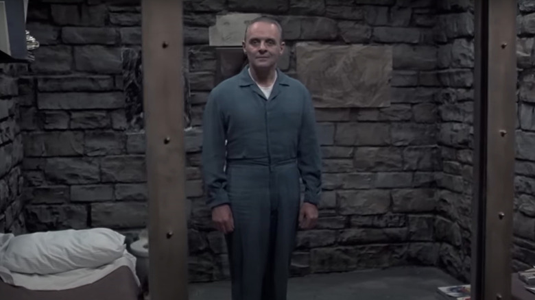 Hannibal Lecter standing in jail cell