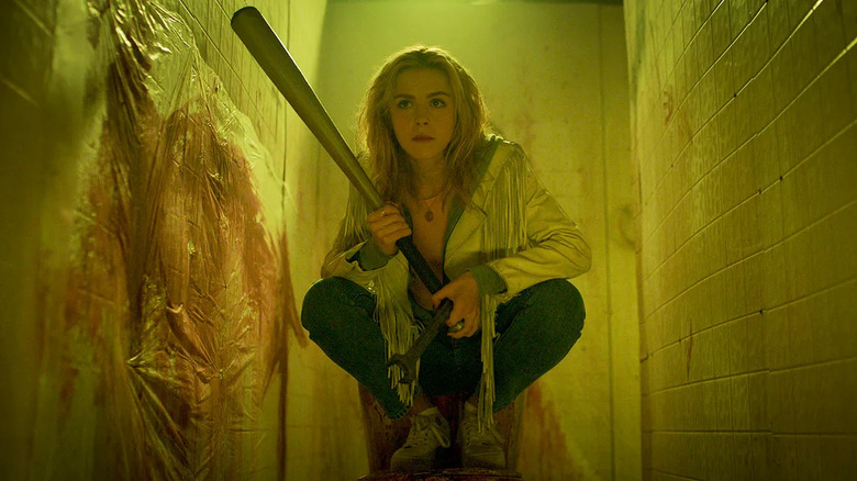 Kiernan Shipka holding a bat in Totally Killer