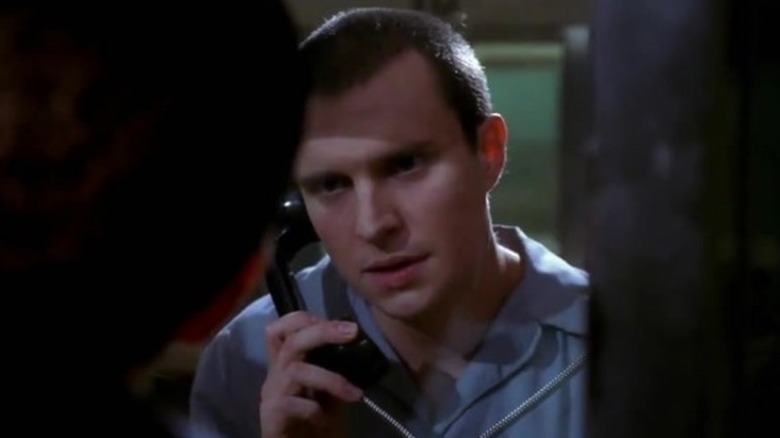 Howard Epps in prison on the phone in Bones