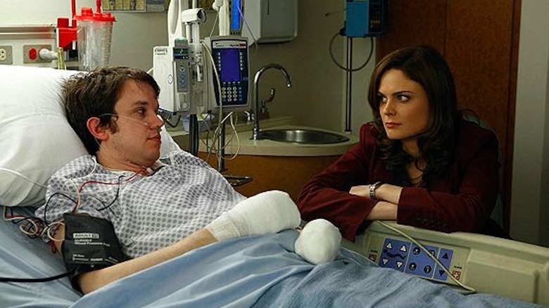 Emily Deschanel as Temperance Brennan sits at the hospital bedside of Eric Millegan as Zack Addy in Bones