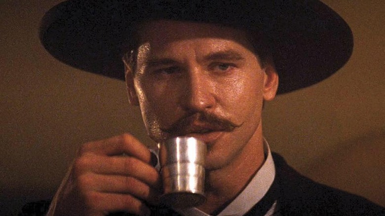 Tombstone Val Kilmer as Doc Holliday drinking