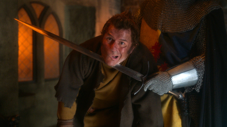 Quasi character with a sword at his throat