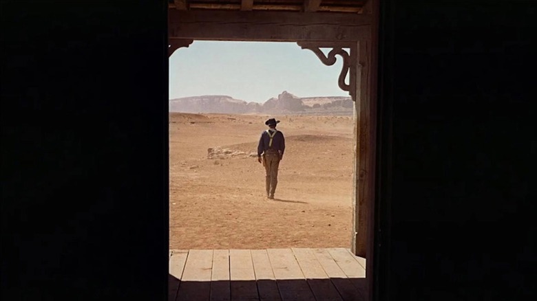 John Wayne framed in the threshold as Ethan Edwards in the famous final shot of The Searchers