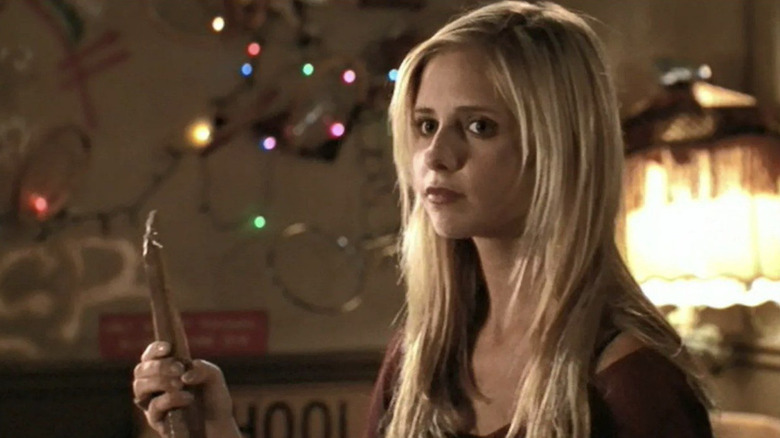 Sarah Michelle Gellar as Buffs holding a stake in Buffy the Vampire Slayer