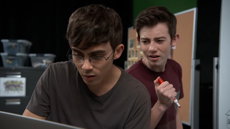 Peter (Tyler Alvarez) and Sam (Griffin Gluck) peering down at a laptop on American Vandal