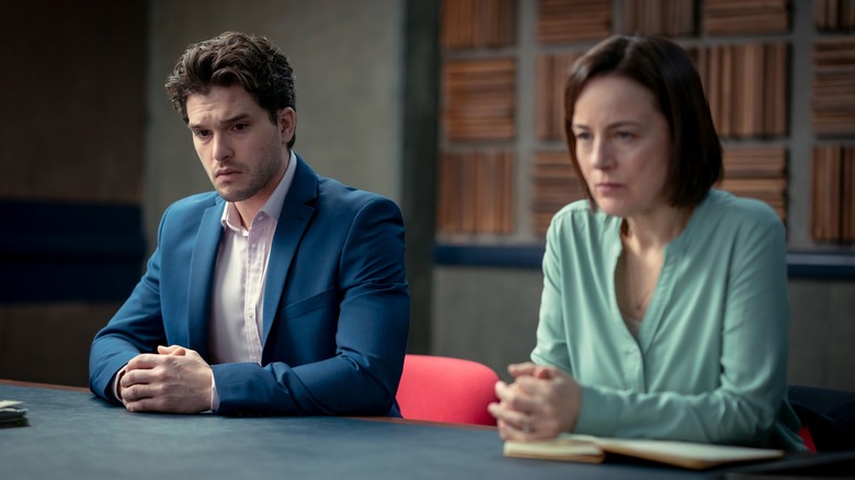 Alex Daniels (Kit Harington) and Roberta Laing (Amanda Drew) looking serious on Criminal: UK