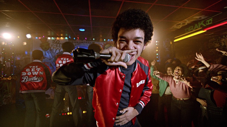 Books (Justice Smith) holds the mic in front of screaming fans on The Get Down