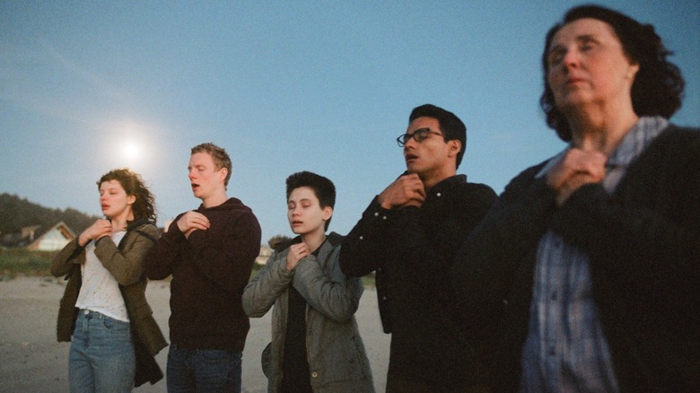 Angie (Chloë Levine), Steve (Patrick Gibson), Buck (Ian Alexander), French (Brandon Perrea), and BBA (Phyllis Smith), hands clutched to their chests on The OA