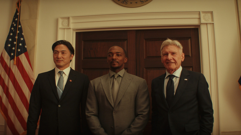 Takehiro Hira as Japanese Prime Minister Ozaki, Anthony Mackie as Sam Wilson, and Harrison Ford as Thaddeus Ross posing for a photo op at the White House in Captain America: Brave New World