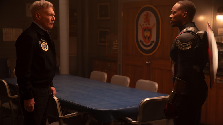 Harrison Ford as President Thaddeus Ross and Anthony Mackie as Sam Wilson facing off in an empty boardroom in Captain America: Brave New World