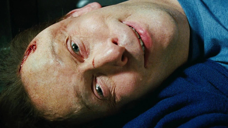 Tim Blake Nelson's Samuel Sterns smiling with a wounded head in The Incredible Hulk