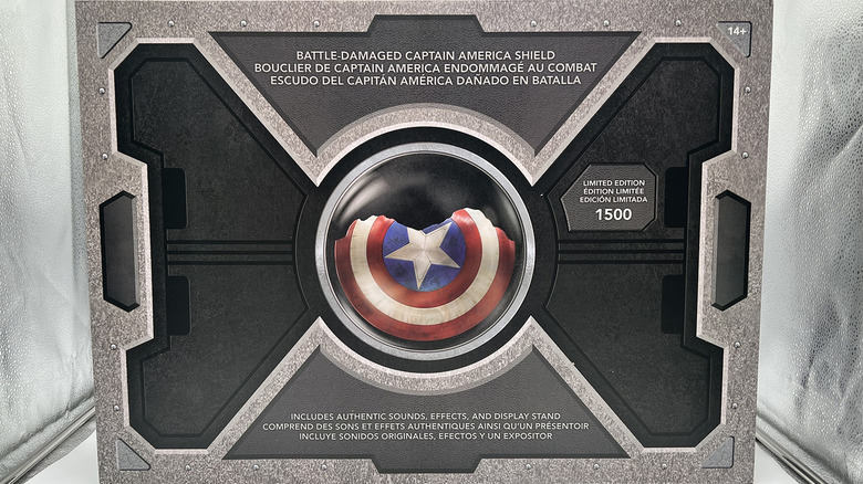 Battle damaged Captain America shield in box