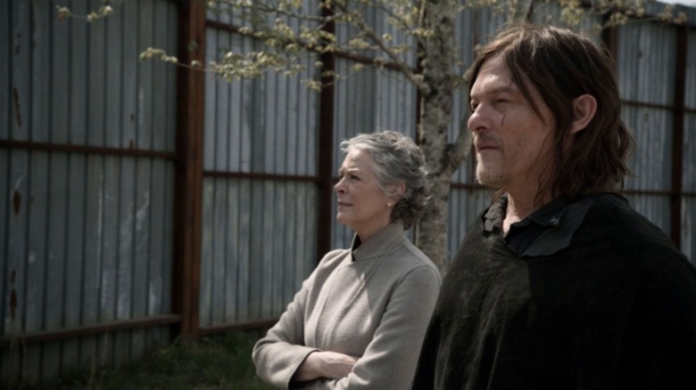 Melissa McBride's Carol and Norman Reedus' Daryl survey their home one more time in the finale of The Walking Dead