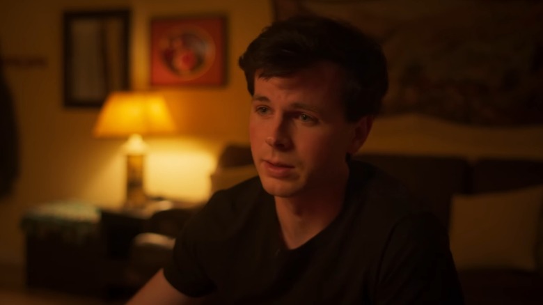 Chandler Riggs' Ben looks sad while speaking to his partner in Breakup Season