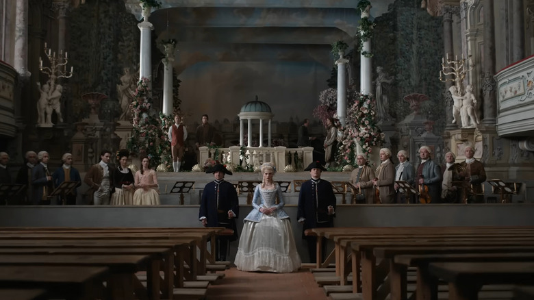 Marie Antoinette (Lucy Boynton) and her court in Chevalier