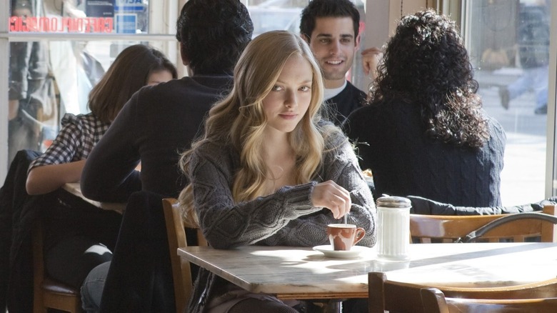 Chloe sitting by herself at a cafe in Chloe