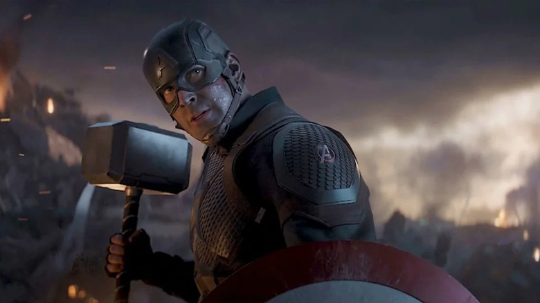 Chris Evans as Captain American holding Thor's hammer in Avengers: Endgame