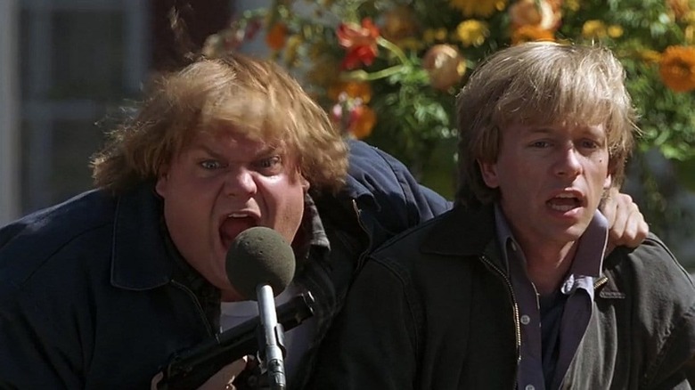 Chris Farley holding David Spade at gunpoint in Black Sheep