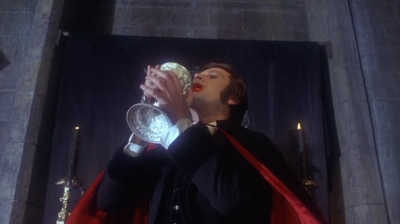 Ralph Bates as Lord Courtley tasting the blood of Dracula in Taste the Blood of Dracula