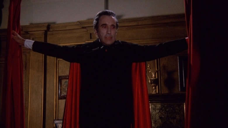 Christopher Lee as Dracula opening curtains in Scars of Dracula