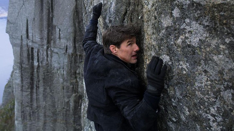 Mission Impossible Fallout Tom Cruise/Ethan Hunt hanging off mountain