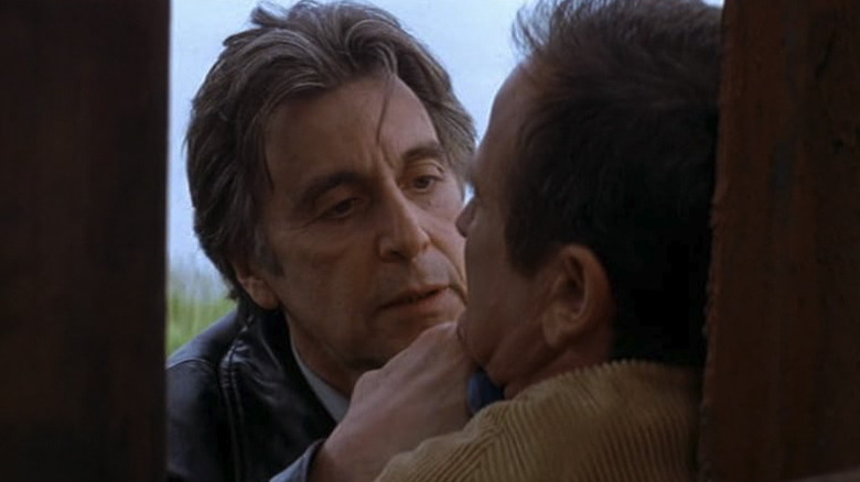 Al Pacino's Will Dormer grabs Robin Williams' Walter Finch by the lapels in Insomnia