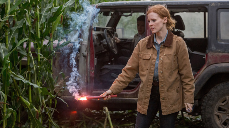 Jessica Chastain as Murph holding a flare in Interstellar