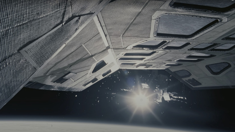 The underside of a space shuttle is shown as it approaches another shuttle in Interstellar