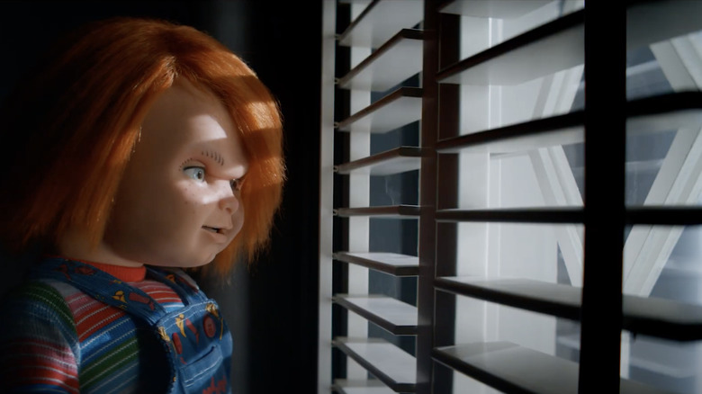 Chucky looking out the window in Chucky