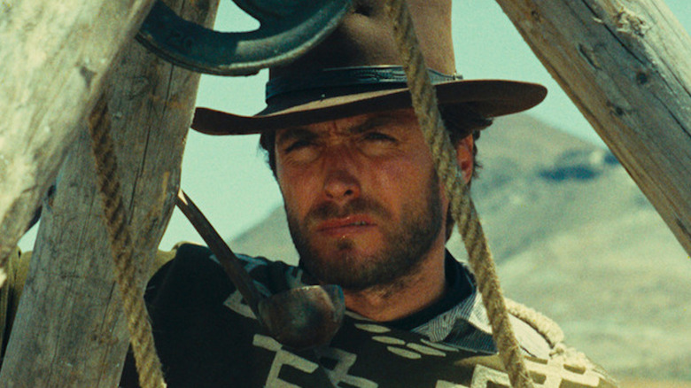 Clint Eastwood sneers over a bucket as the Man with No Name in A Fistful of Dollars