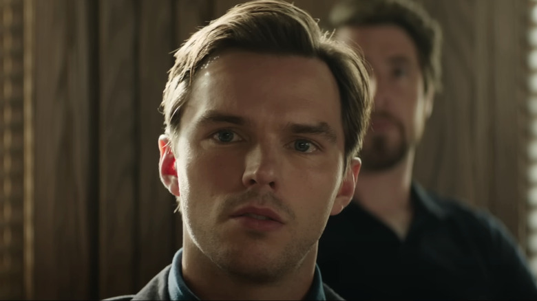 Nicholas Hoult's Justin Kemp sits looking concerned in the courtroom in Juror No. 2