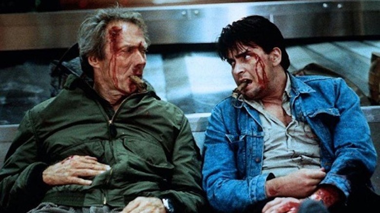 Clint Eastwood and Charlie Sheen looking rough with rough cigars in The Rookie