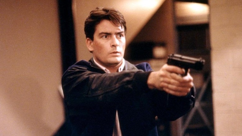 Charlie Sheen pointing a gun in The Rookie