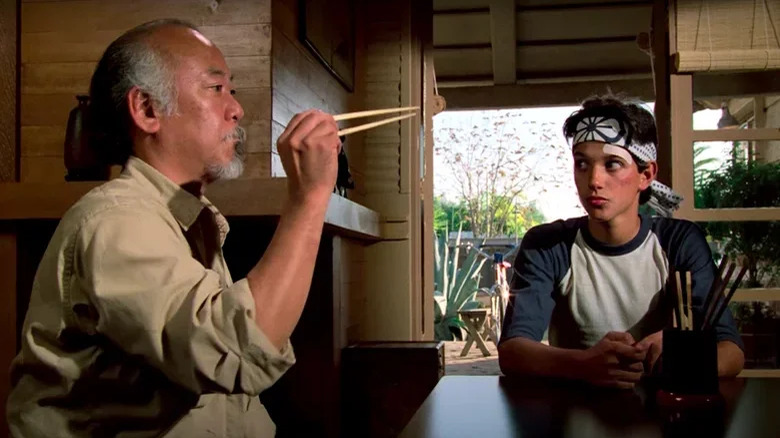 Miyagi catching a fly with chopsticks in The Karate Kid