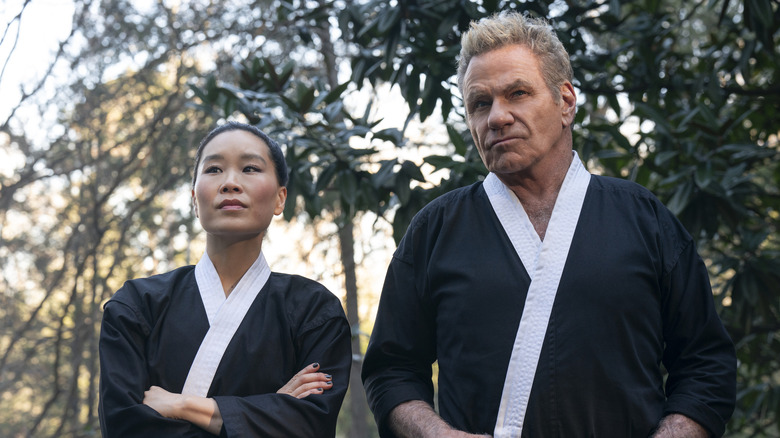 Kim Da-Eun standing next to Kreese and overseeing her students in Cobra Kai