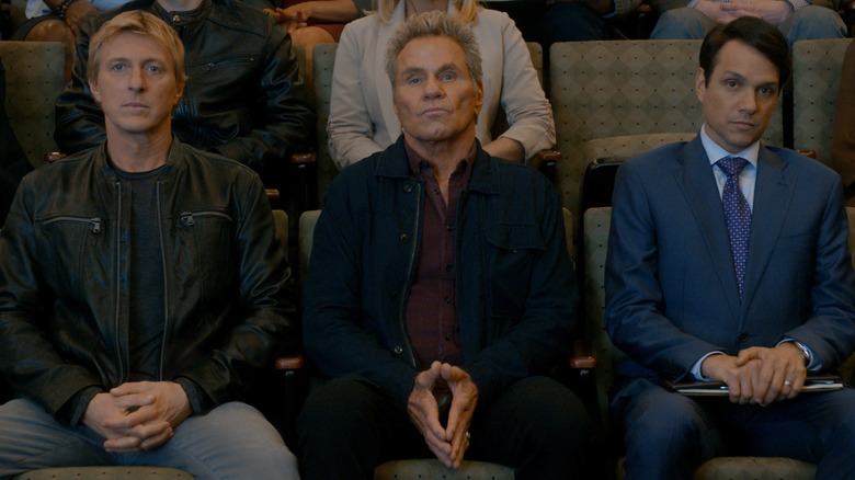 Nyoni Lawrence, Johnon Crays and Daniel Laruso sitting together on Cobra Kai