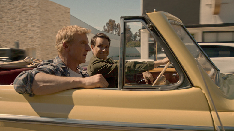 Daniel and Johnny driving a car in Cobra Kai